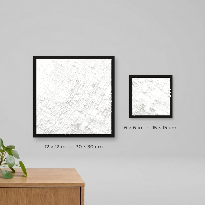 Size comparison: 6x6 in (15x15 cm) and 12x12 in (30x30 cm) 3D City Frames shown on a wall at true relative scale